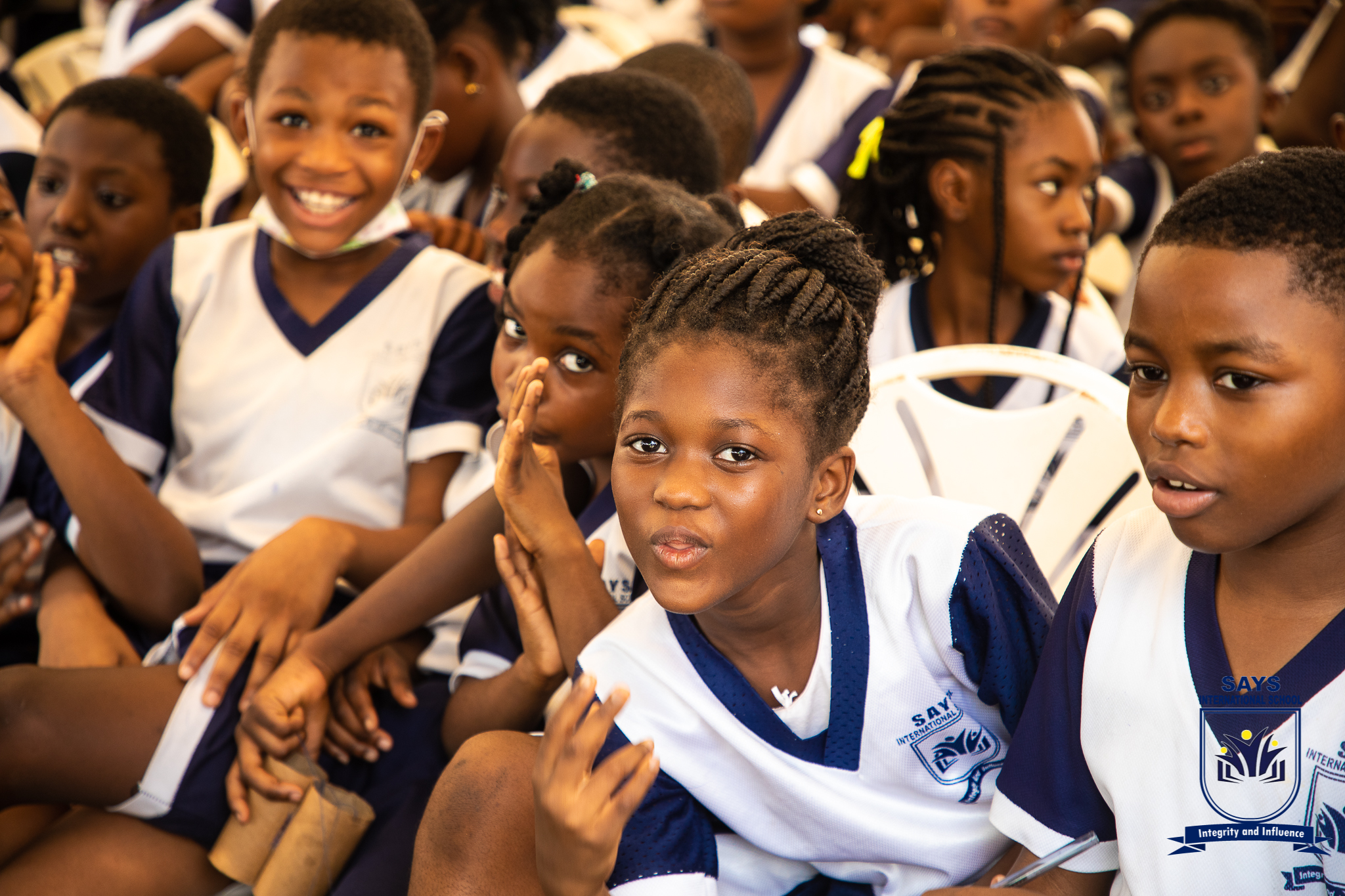 Pupils outside the school building