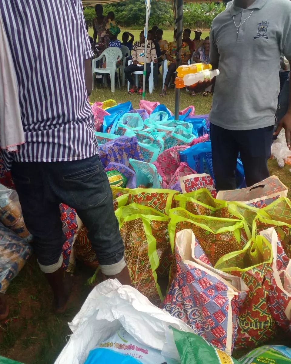 Community members preparing to receive food items