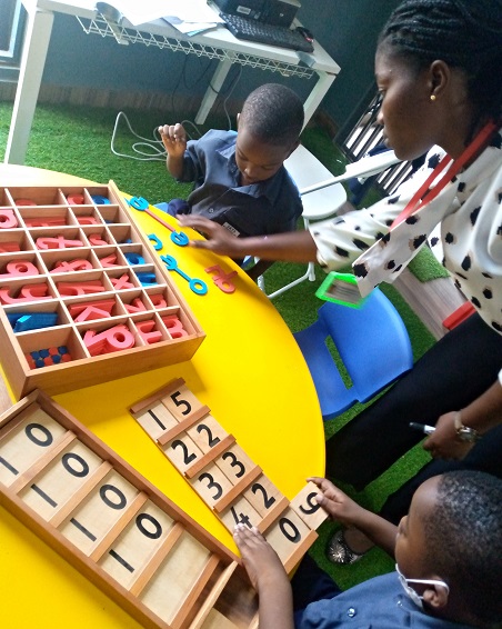 Teacher helping with circle time activity