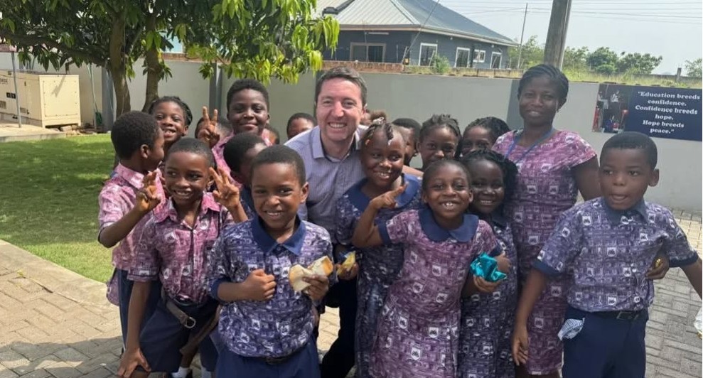 Pupils with a staff member on campus